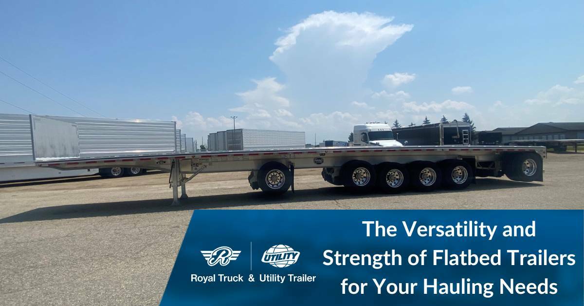 Flatbed trailer in a parking lot. The versatility and strength of flatbed trailers for your hauling needs. Royal Truck & Utility Trailer.