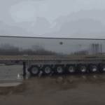 2026 MAC 8-Axle Aluminum Dump Trailer parked at Royal Truck & Utility Trailer