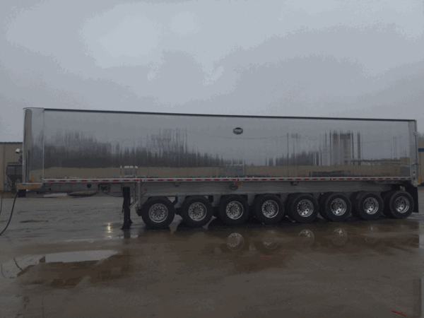 2026 MAC 8-Axle Aluminum Dump Trailer parked at Royal Truck & Utility Trailer